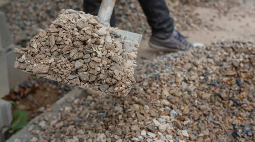 Construction technicians are mixing cement, stone, sand for construction.